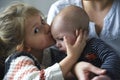 Little girl kissing her baby brother Royalty Free Stock Photo